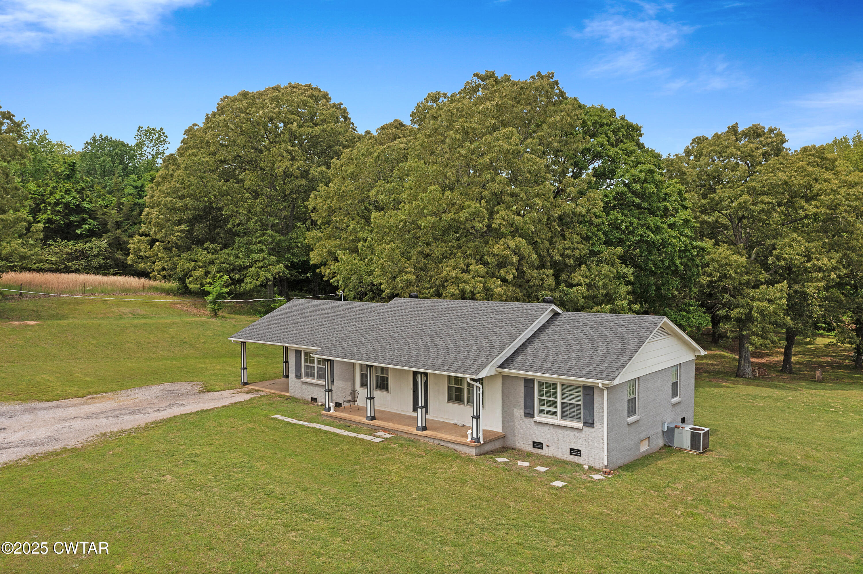 5790 Smyrna Road Westport, TN 38387 - Photo 1 of 26 an aerial view of a house with a garden