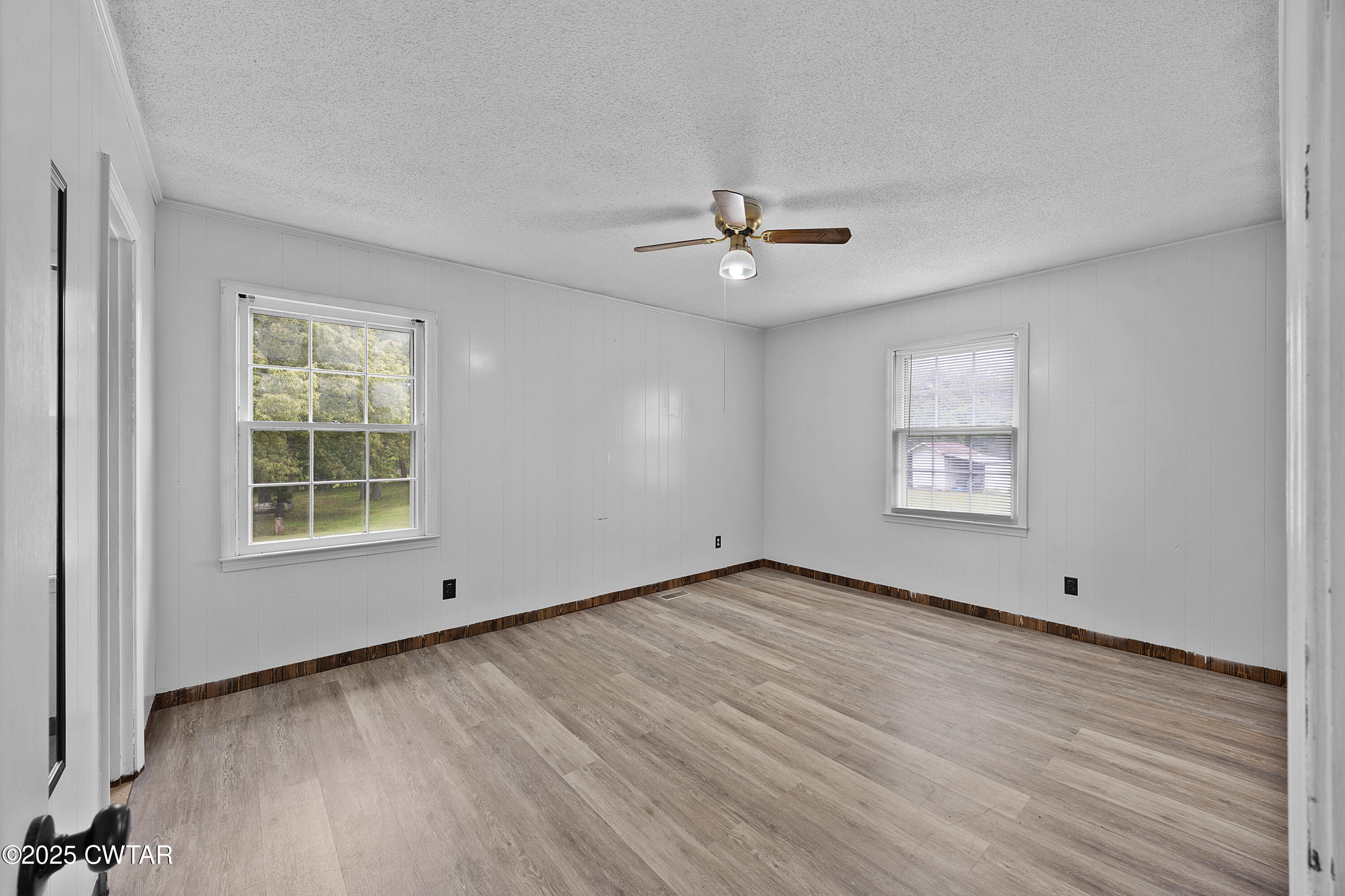 5790 Smyrna Road Westport, TN 38387 - Photo 20 of 26 a view of an empty room with a window and wooden floor