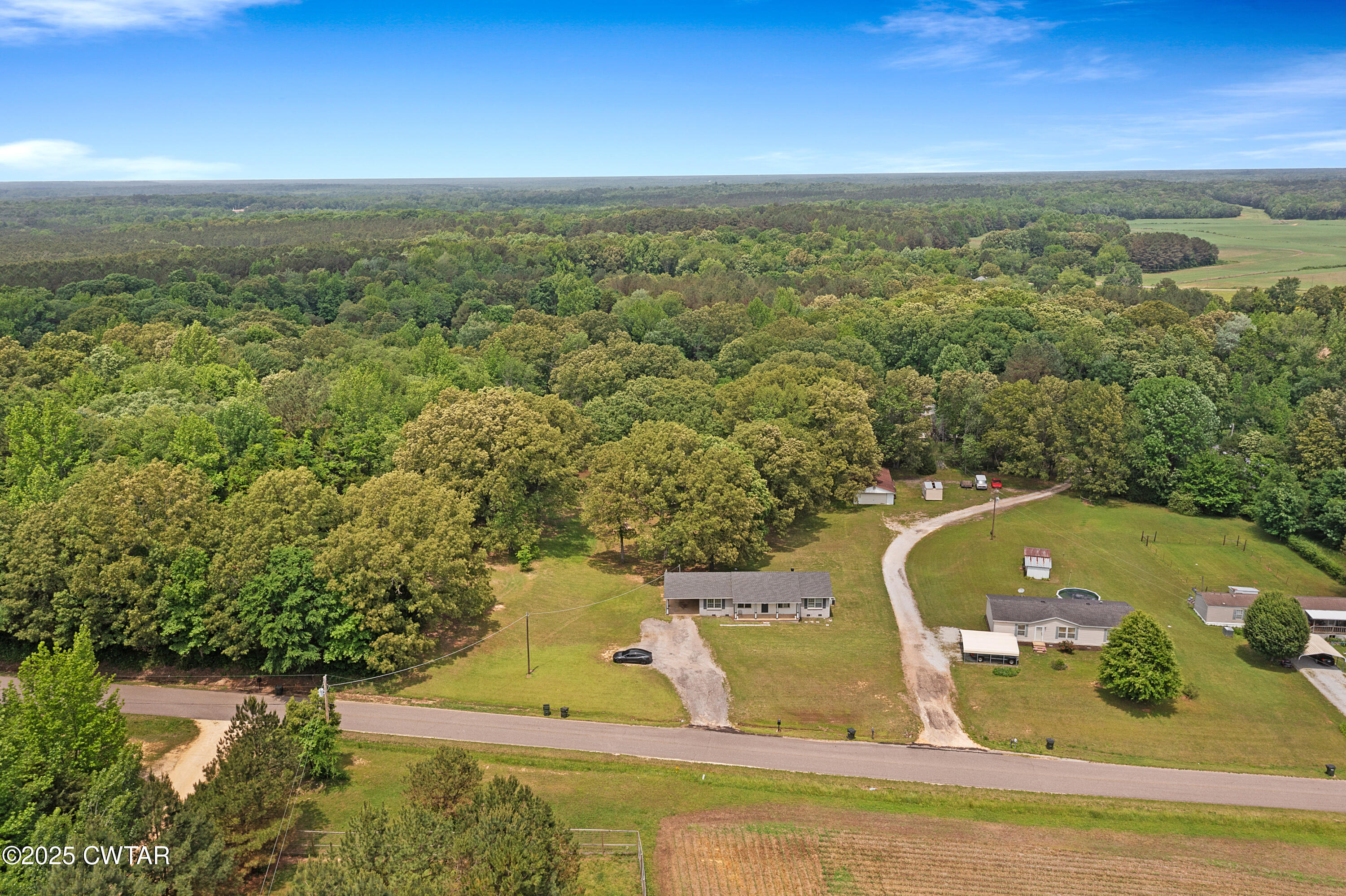 5790 Smyrna Road Westport, TN 38387 - Photo 2 of 26 a view of a lake from a balcony