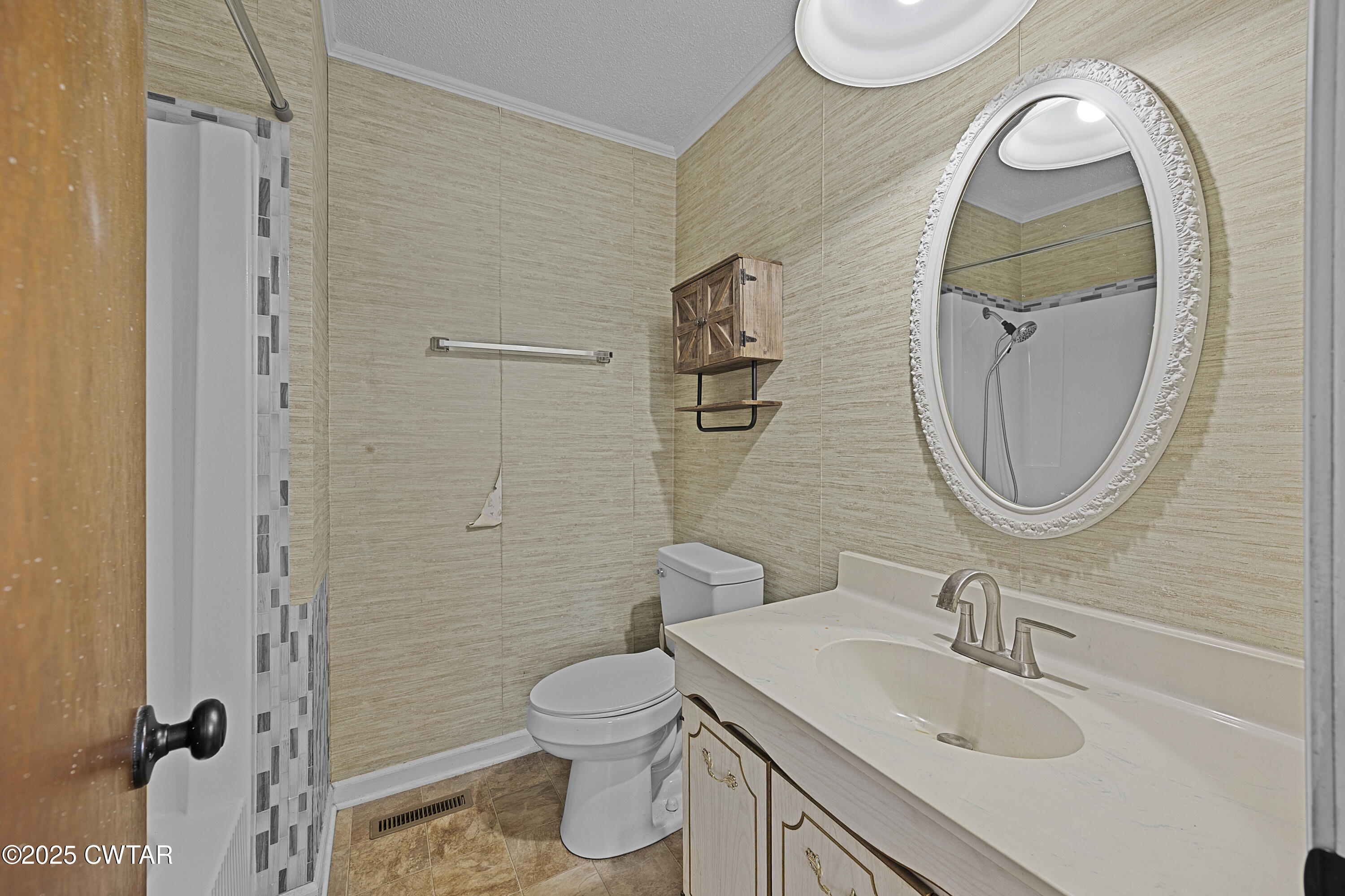 5790 Smyrna Road Westport, TN 38387 - Photo 22 of 26 a bathroom with a sink a toilet and a mirror