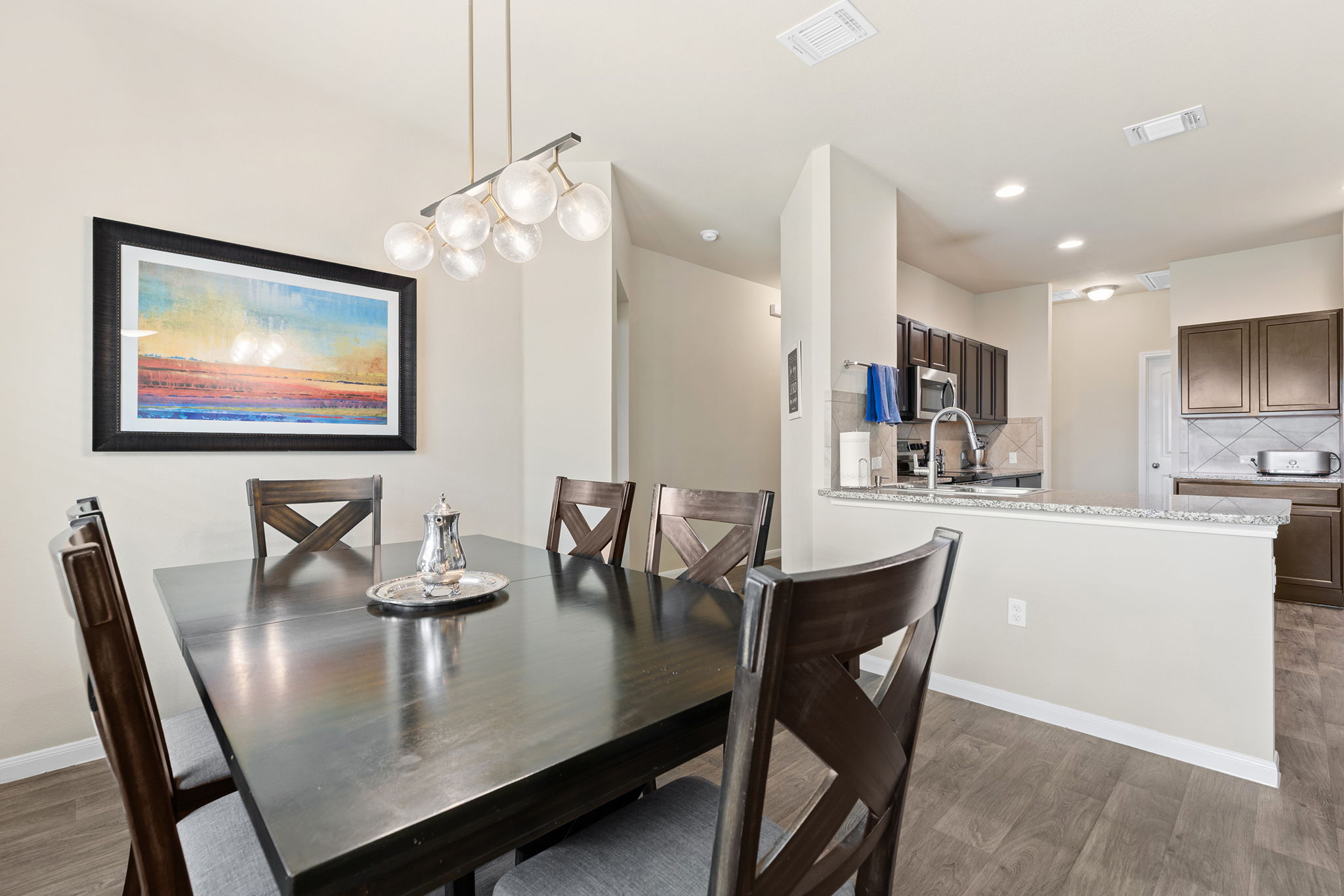 404 Cassandra Drive Hutto, TX 78634 - Photo 13 of 40 Dining room with light wood-type flooring and baseboards