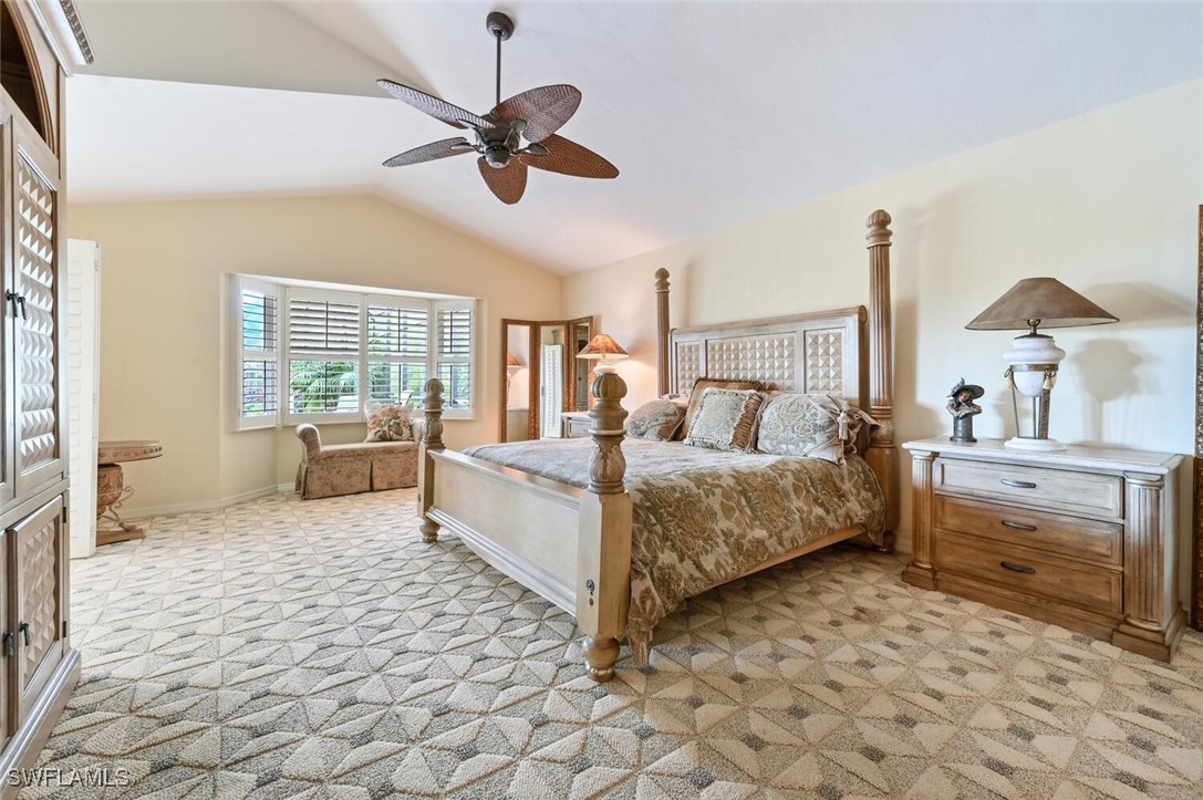 481 Crestwood Road Naples, FL 34113 - Photo 17 of 27 a bed room with a bed and a chair