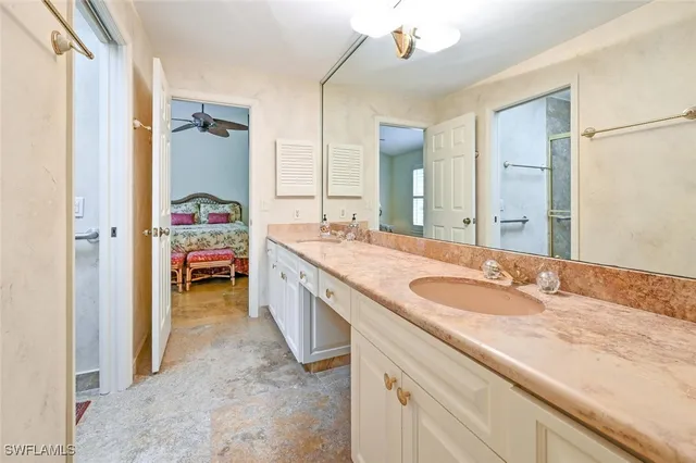 a white toilet sitting next to a bathroom sink