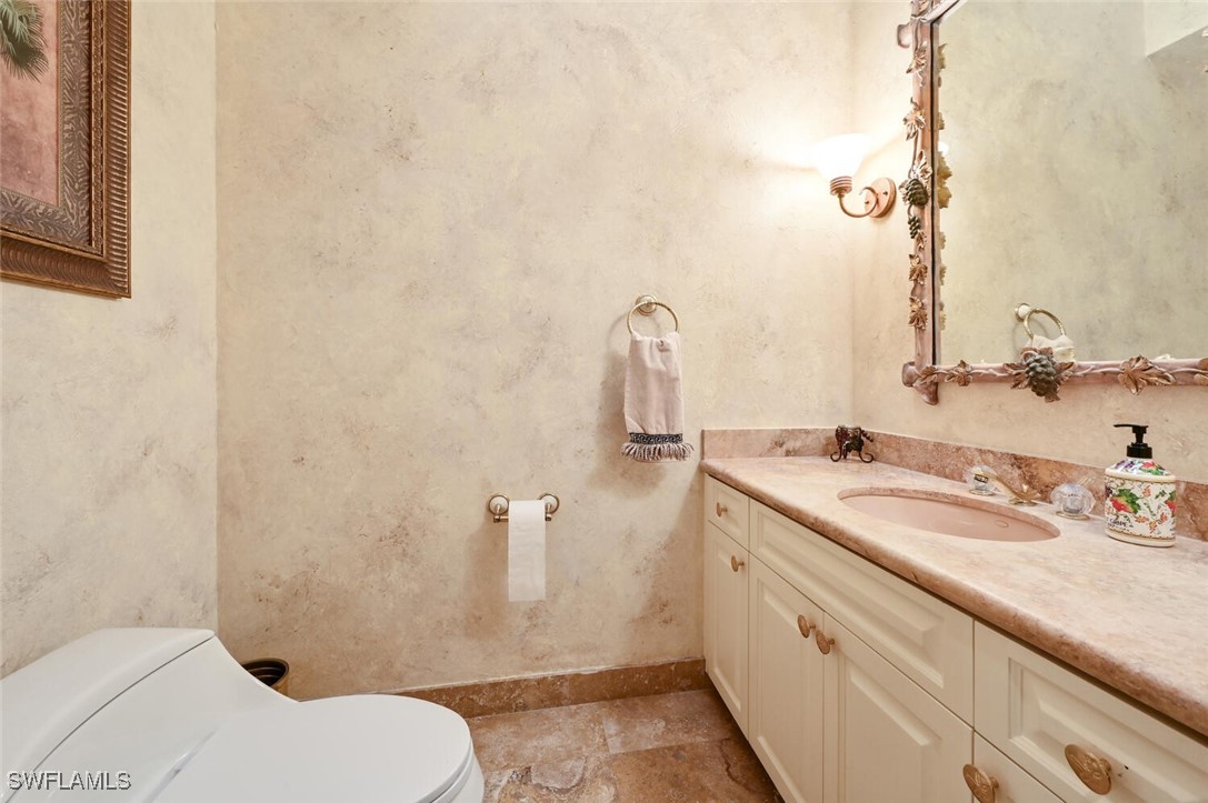 481 Crestwood Road Naples, FL 34113 - Photo 22 of 27 a bathroom with a granite countertop sink toilet and shower