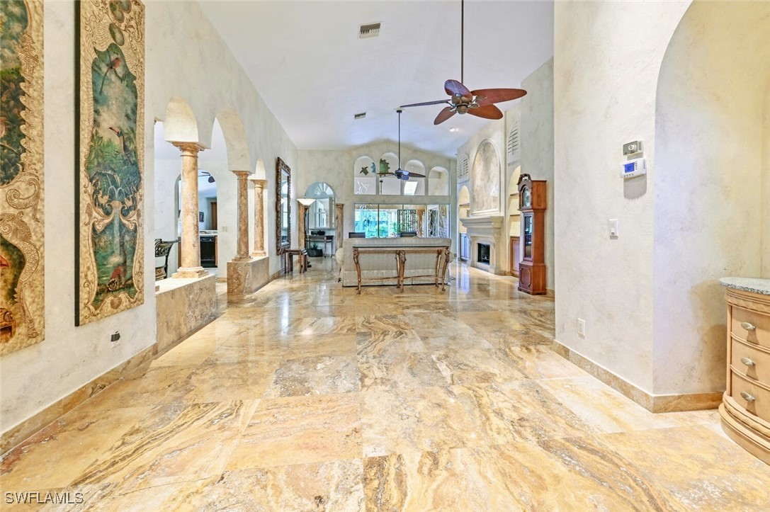 481 Crestwood Road Naples, FL 34113 - Photo 9 of 27 a view of a living room and bathroom