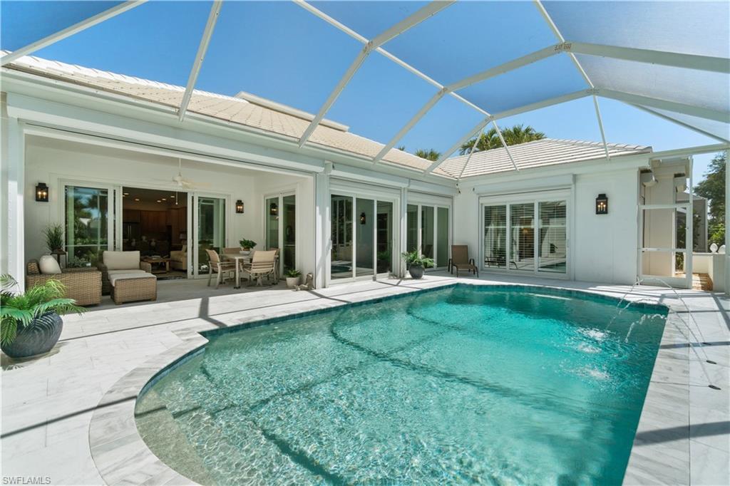 764 Ashburton Drive Naples, FL 34110 - Photo 16 of 30 a view of a house with backyard porch and furniture