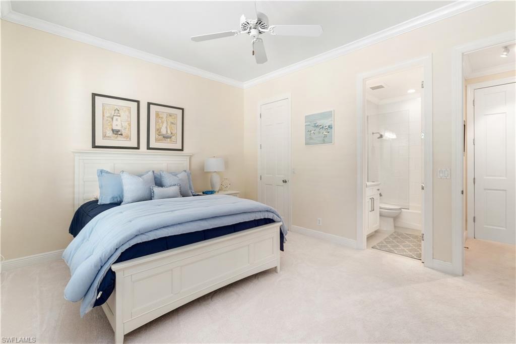 764 Ashburton Drive Naples, FL 34110 - Photo 23 of 30 a spacious bedroom with a bed and closet