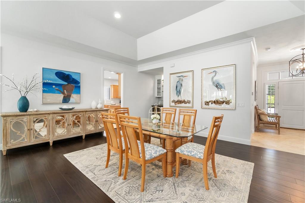 764 Ashburton Drive Naples, FL 34110 - Photo 4 of 30 a dining room with furniture and wooden floor
