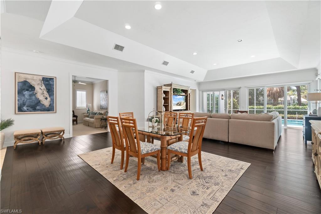 764 Ashburton Drive Naples, FL 34110 - Photo 6 of 30 a view of a dining room with furniture and wooden floor