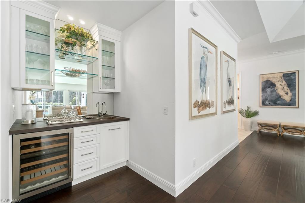 764 Ashburton Drive Naples, FL 34110 - Photo 8 of 30 a kitchen with stainless steel appliances a stove and a window