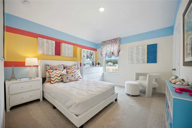 a bedroom with a bed and a couch