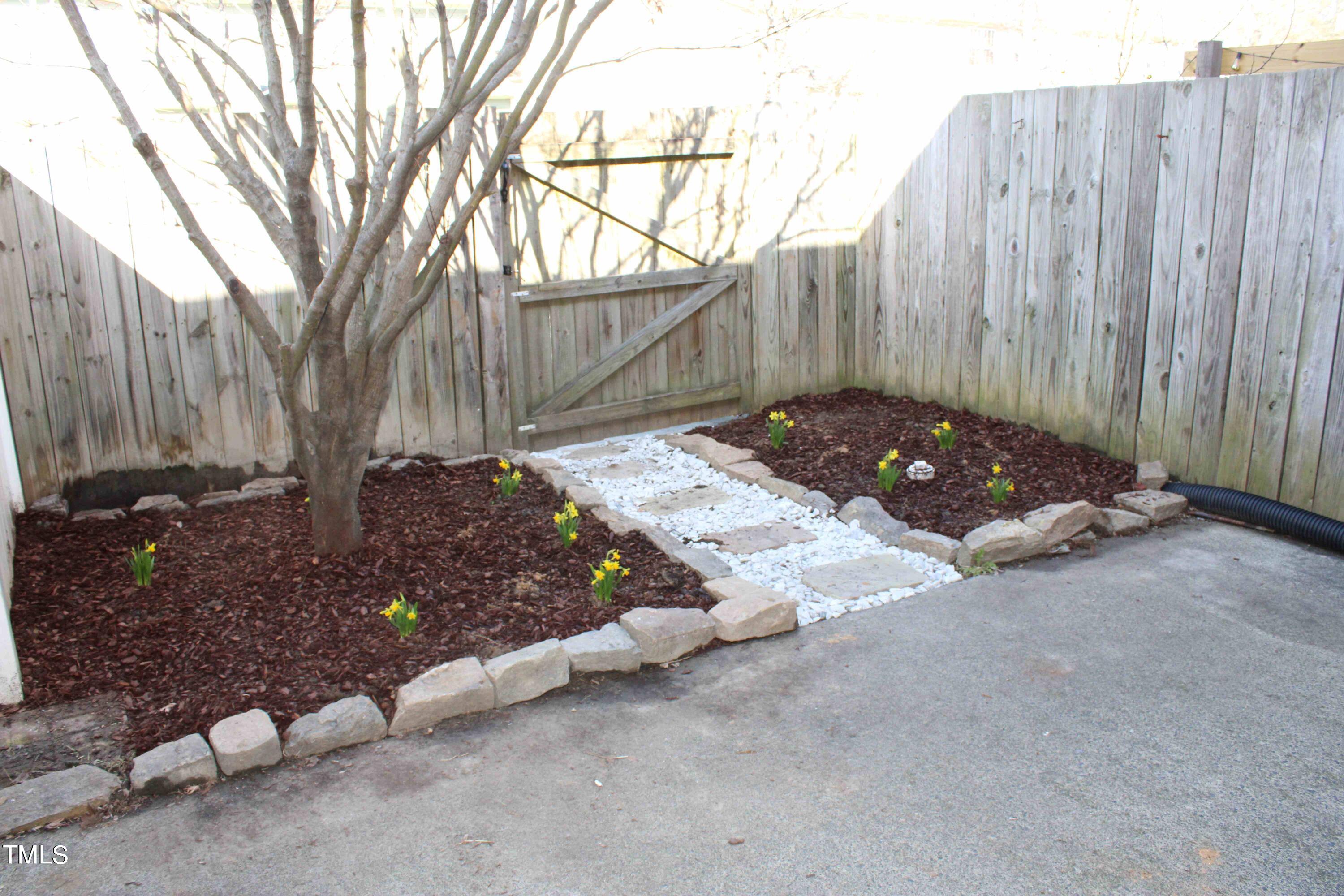 4426 Cottage Stone Drive Raleigh, NC 27616 - Photo 23 of 25 a view of backyard with wooden fence
