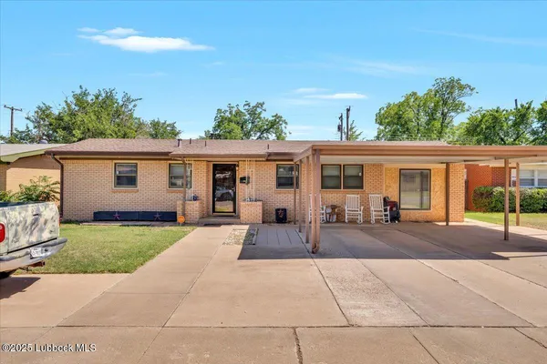front view of a house with a patio