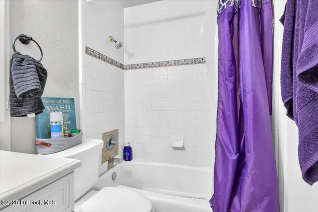 a bedroom with a bed and flat screen tv