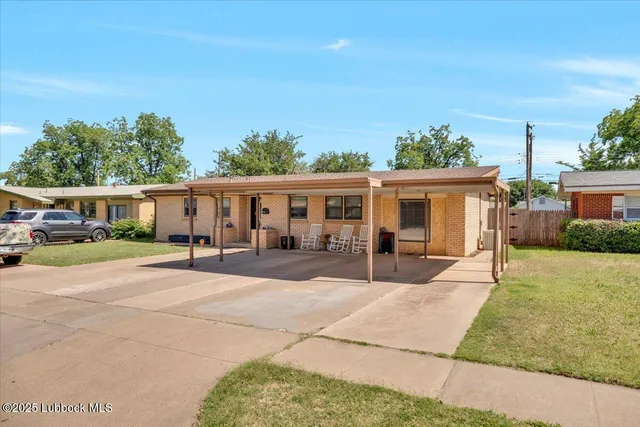 front view of a house with a patio