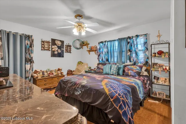 a view of a livingroom with furniture and hardwood floor