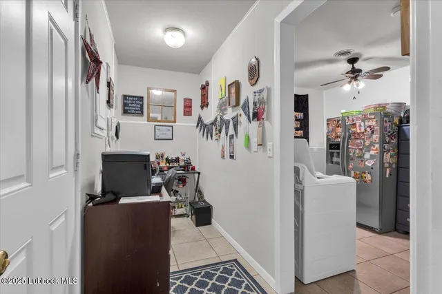 a utility room with cabinets washer and dryer