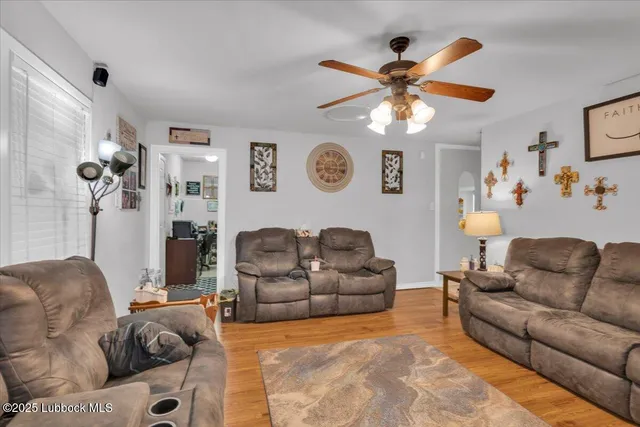 a living room with furniture and a window
