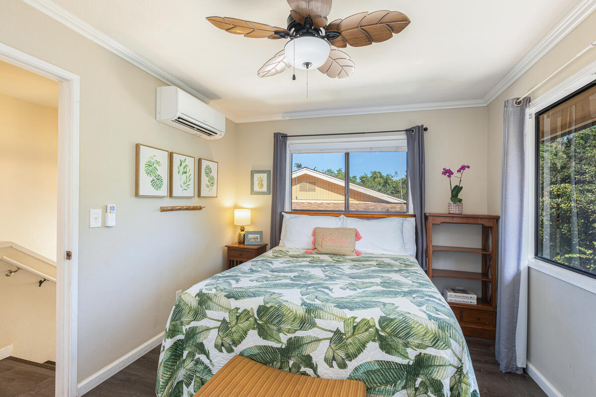 4800 Hanalei Plantation Road, Unit 5A Princeville, HI 96722 - Photo 16 of 20 a bedroom with a bed and a chandelier