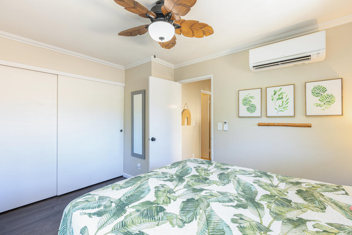 4800 Hanalei Plantation Road, Unit 5A Princeville, HI 96722 - Photo 18 of 20 a bedroom with bed and a chandelier