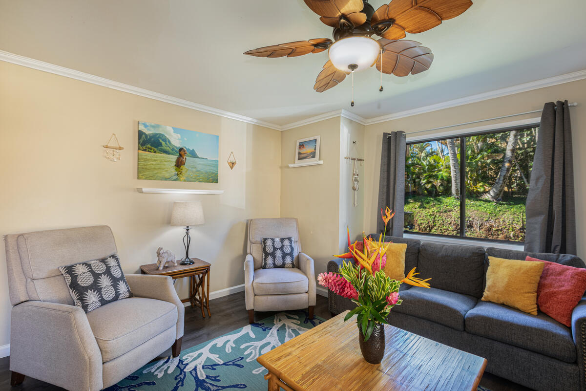 4800 Hanalei Plantation Road, Unit 5A Princeville, HI 96722 - Photo 4 of 20 a living room with furniture and a large window