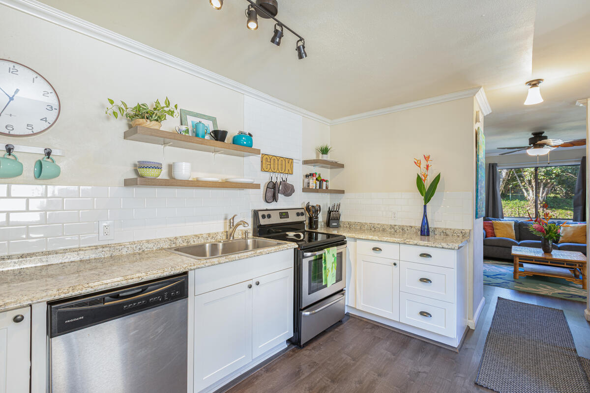 4800 Hanalei Plantation Road, Unit 5A Princeville, HI 96722 - Photo 6 of 20 a kitchen with a sink stove and cabinets