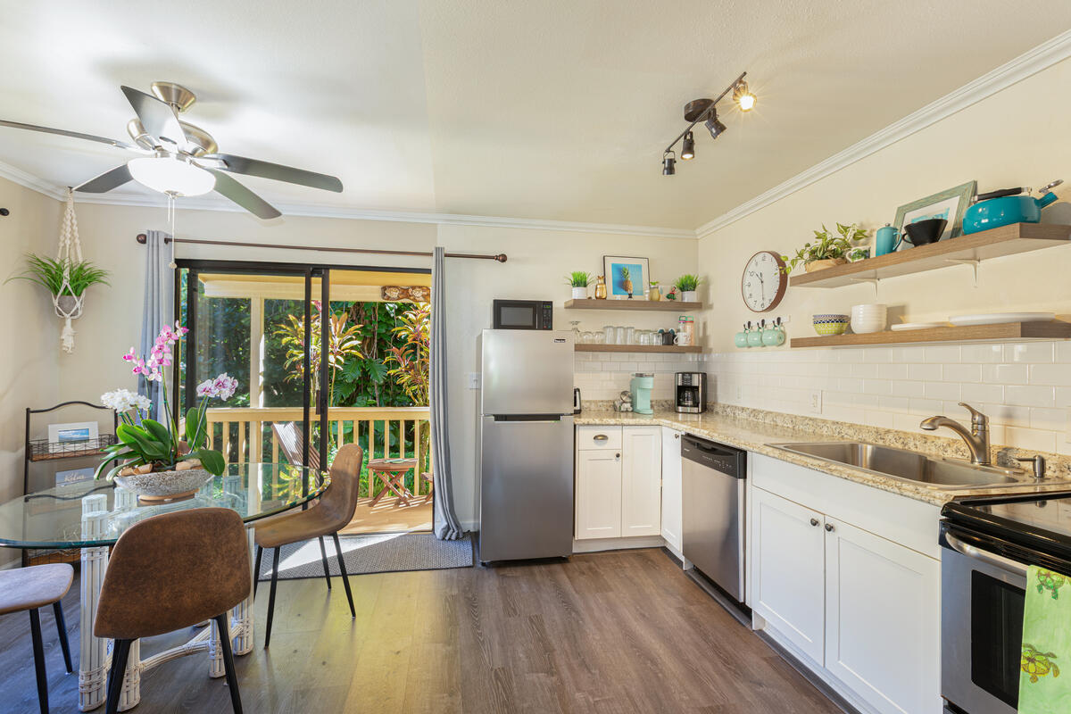 4800 Hanalei Plantation Road, Unit 5A Princeville, HI 96722 - Photo 7 of 20 a kitchen with stainless steel appliances a stove a sink and a refrigerator