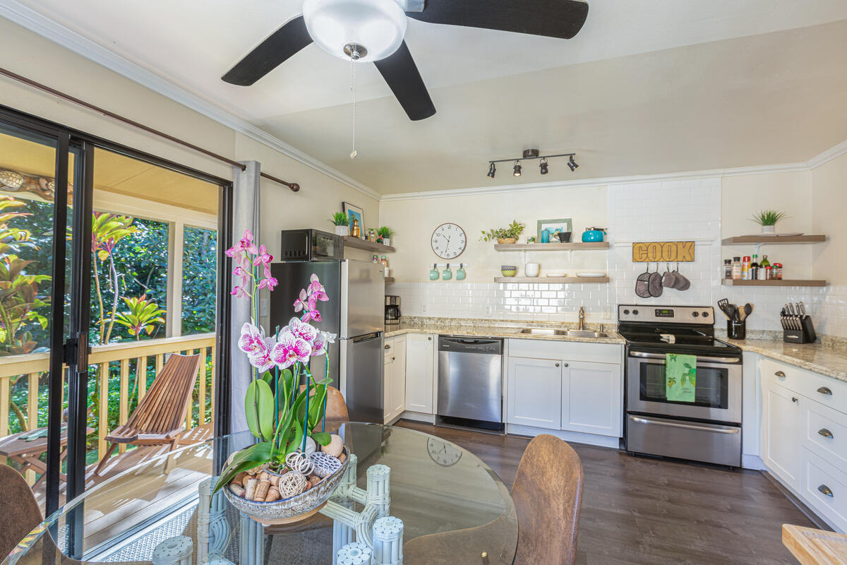 4800 Hanalei Plantation Road, Unit 5A Princeville, HI 96722 - Photo 9 of 20 a open kitchen with granite countertop a stove and a refrigerator