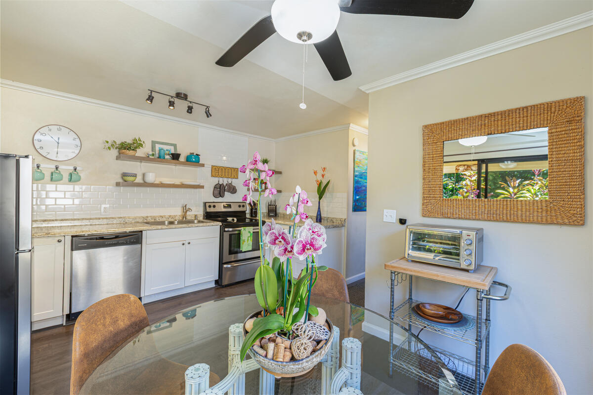 4800 Hanalei Plantation Road, Unit 5A Princeville, HI 96722 - Photo 10 of 20 a living room with furniture and a potted plant