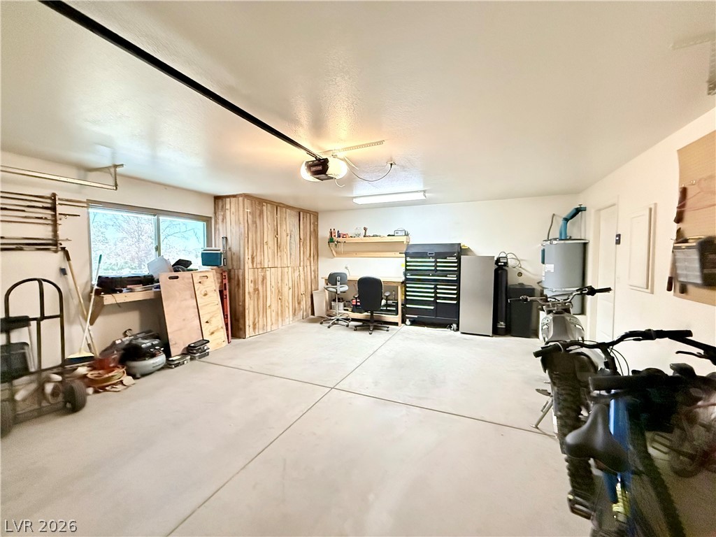 1220 East Gamebird Road Pahrump, NV 89048 - Photo 38 of 49 Ample 2 car garage space with built-in storage solutions and dedicated workshop area for any project.