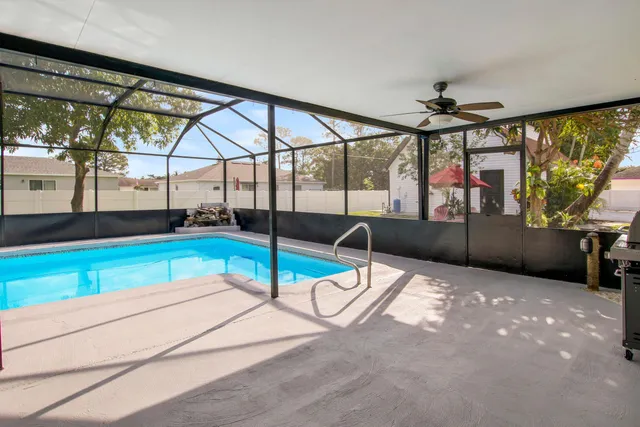 a living room with hardwood floor and windows