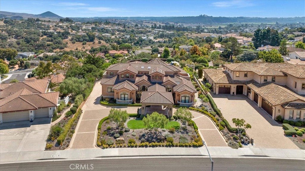 an aerial view of a house with a garden