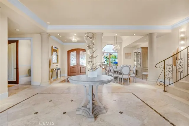 a bedroom with a bed a window and a couch