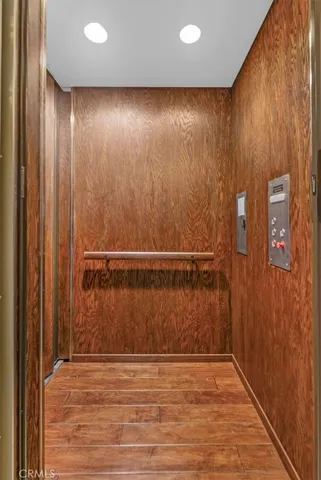 a bathroom with a toilet a sink and a mirror