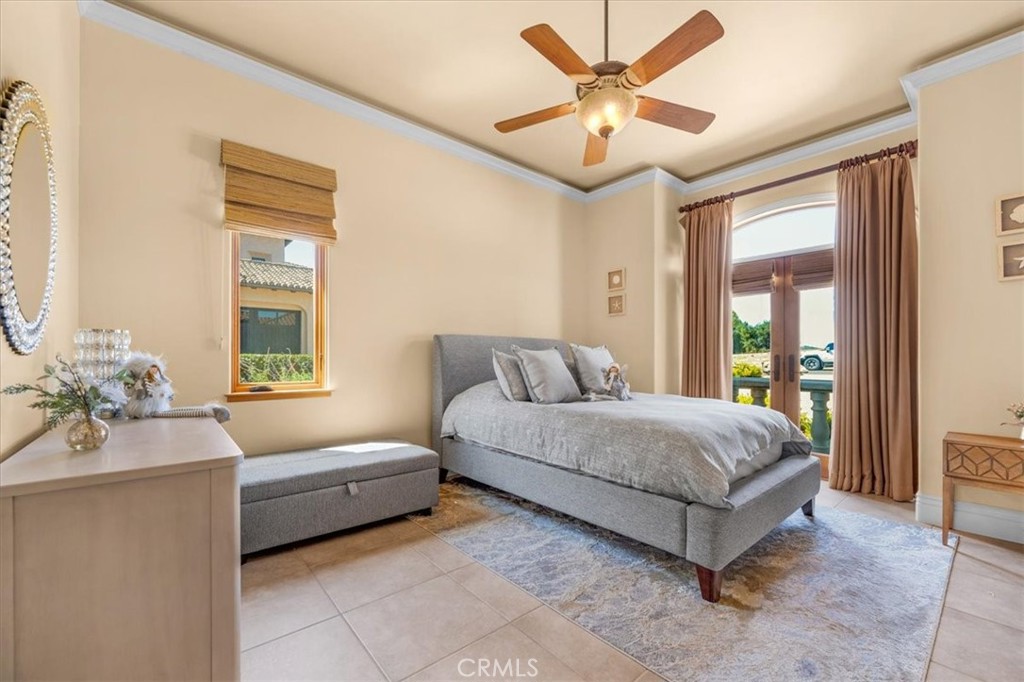 413 Via Bandolero Arroyo Grande, CA 93420 - Photo 26 of 75 a spacious bedroom with a bed and window