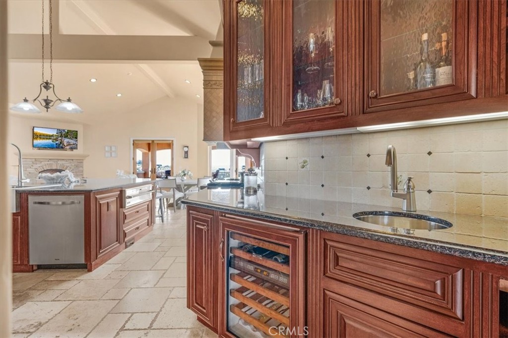 413 Via Bandolero Arroyo Grande, CA 93420 - Photo 32 of 75 a kitchen with stainless steel appliances granite countertop a sink stove and cabinets