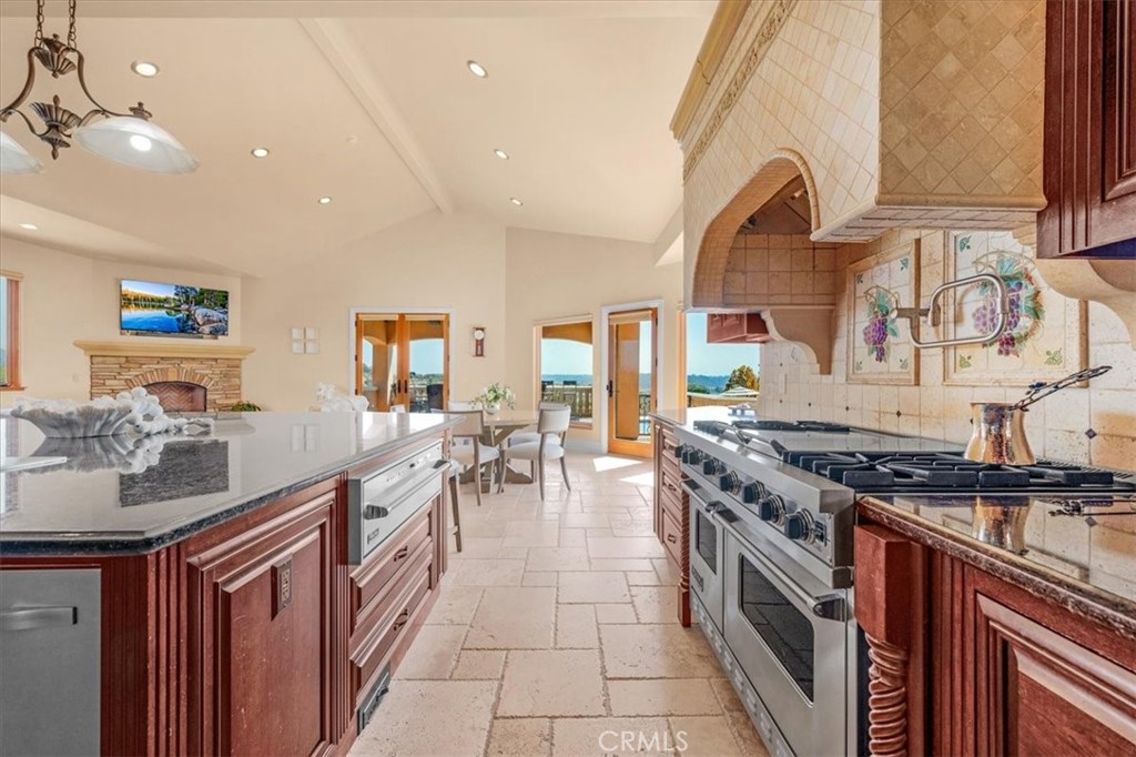 413 Via Bandolero Arroyo Grande, CA 93420 - Photo 33 of 75 a kitchen with stainless steel appliances granite countertop a stove and a sink