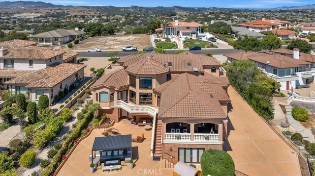 an aerial view of residential houses with a city view