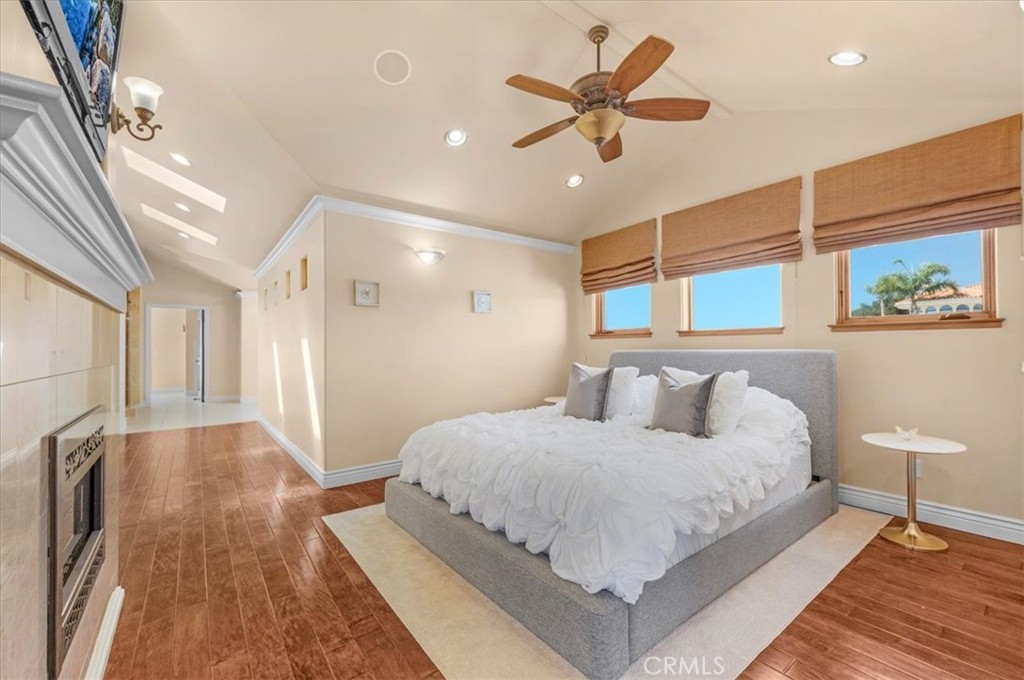 413 Via Bandolero Arroyo Grande, CA 93420 - Photo 41 of 75 a bedroom with a large bed chandelier and a window