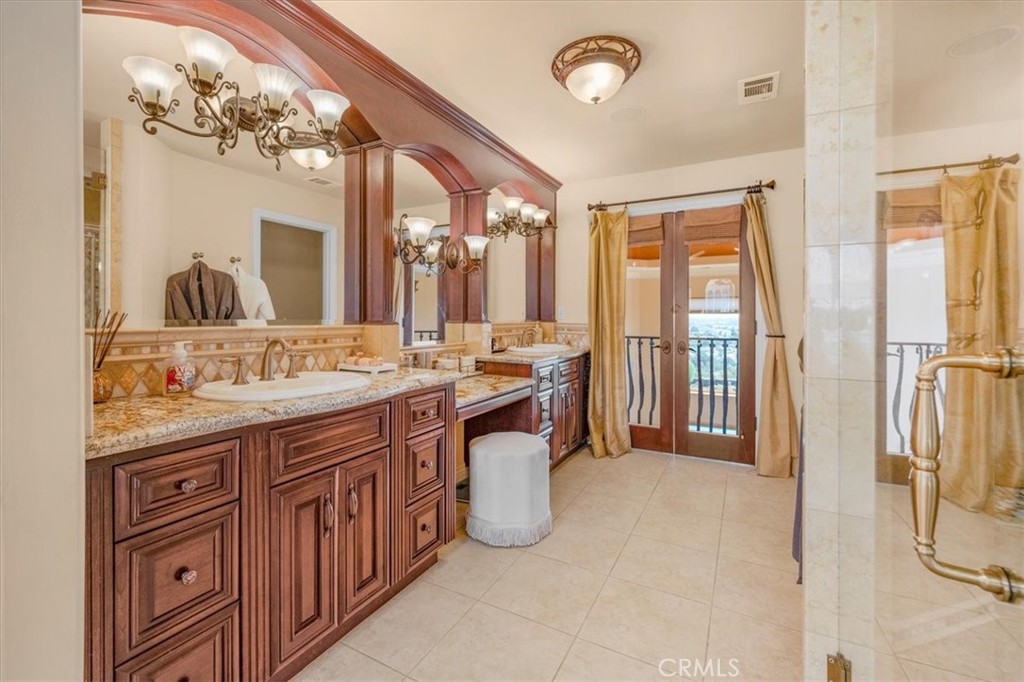 413 Via Bandolero Arroyo Grande, CA 93420 - Photo 49 of 75 a spacious bathroom with a sink double vanity and a mirror