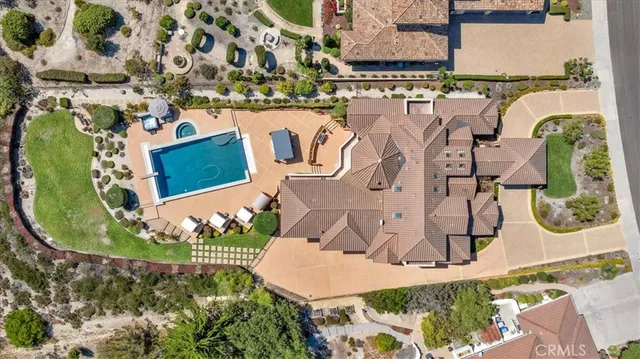 a front view of a house with garden and outdoor seating