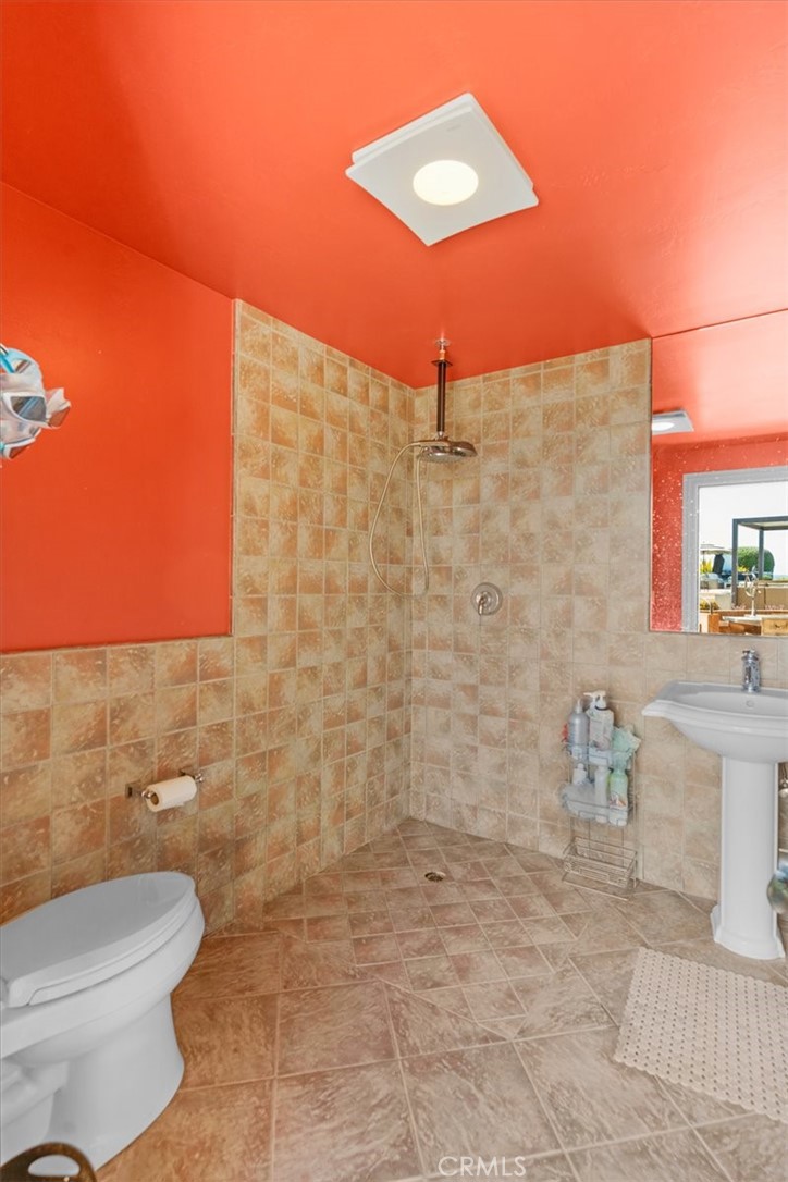 413 Via Bandolero Arroyo Grande, CA 93420 - Photo 70 of 75 a bathroom with a toilet and a shower