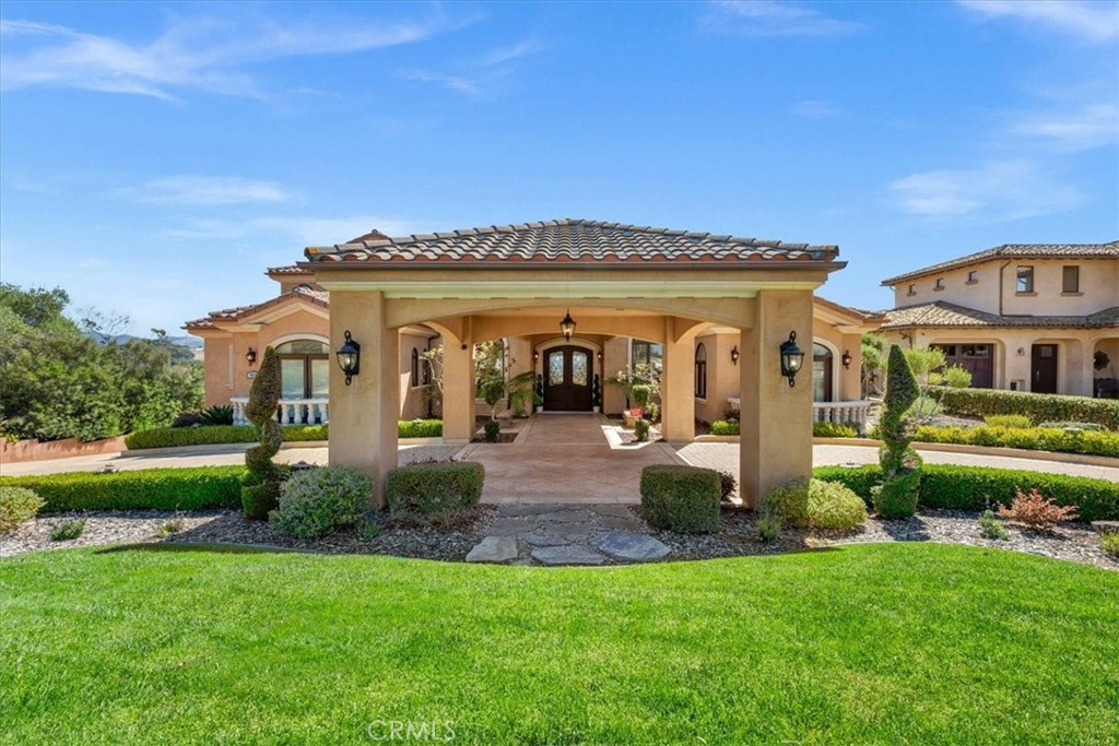 413 Via Bandolero Arroyo Grande, CA 93420 - Photo 9 of 75 a front view of a house with garden and outdoor seating