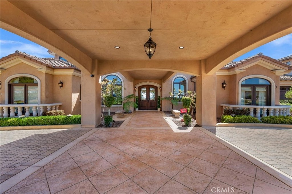 413 Via Bandolero Arroyo Grande, CA 93420 - Photo 10 of 75 a view of a house with large windows and a small yard