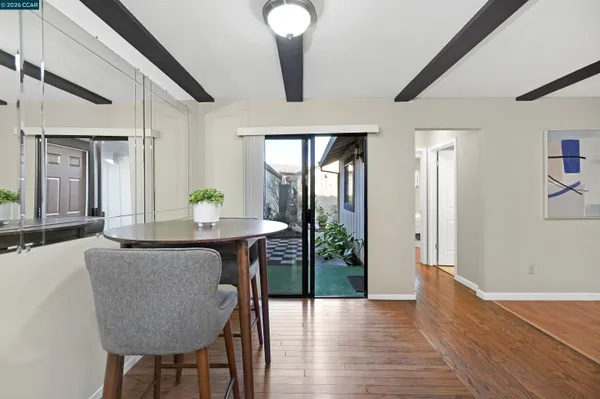 a view of a dining room with furniture and wooden floor
