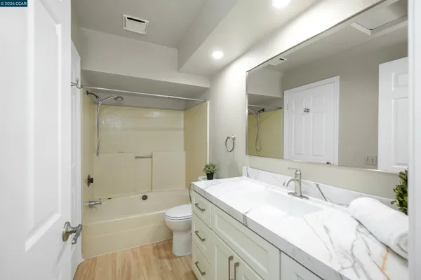 a bathroom with a sink a toilet and a bathtub