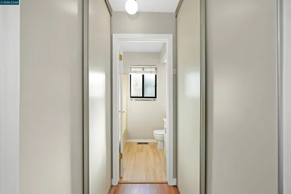 a view of a bathroom from a hallway