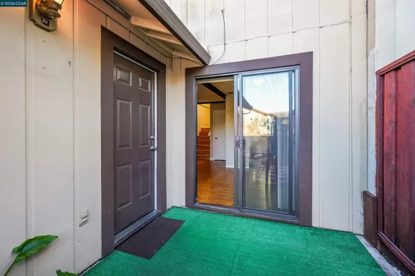 a view of porch with a door and chair