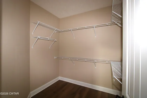 a view of an empty walk in closet