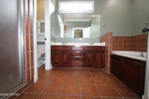 a kitchen with stainless steel appliances a sink stove and cabinets